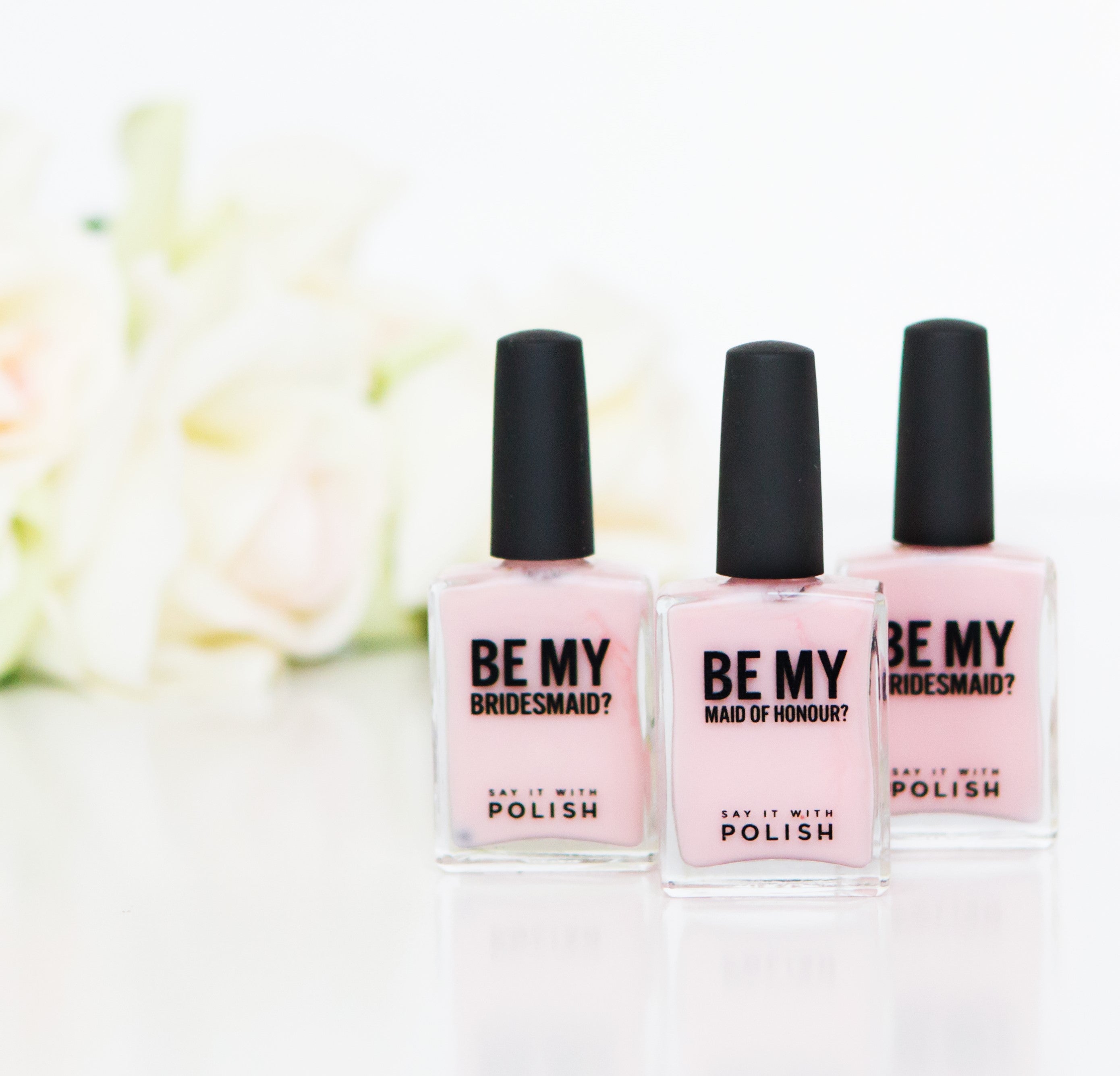 pink nail polish with 'be my bridesmaid?' text on front