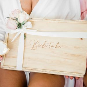 bride to be engraved in wooden gift box, finished with a bridal white ribbon and light blush pink roses