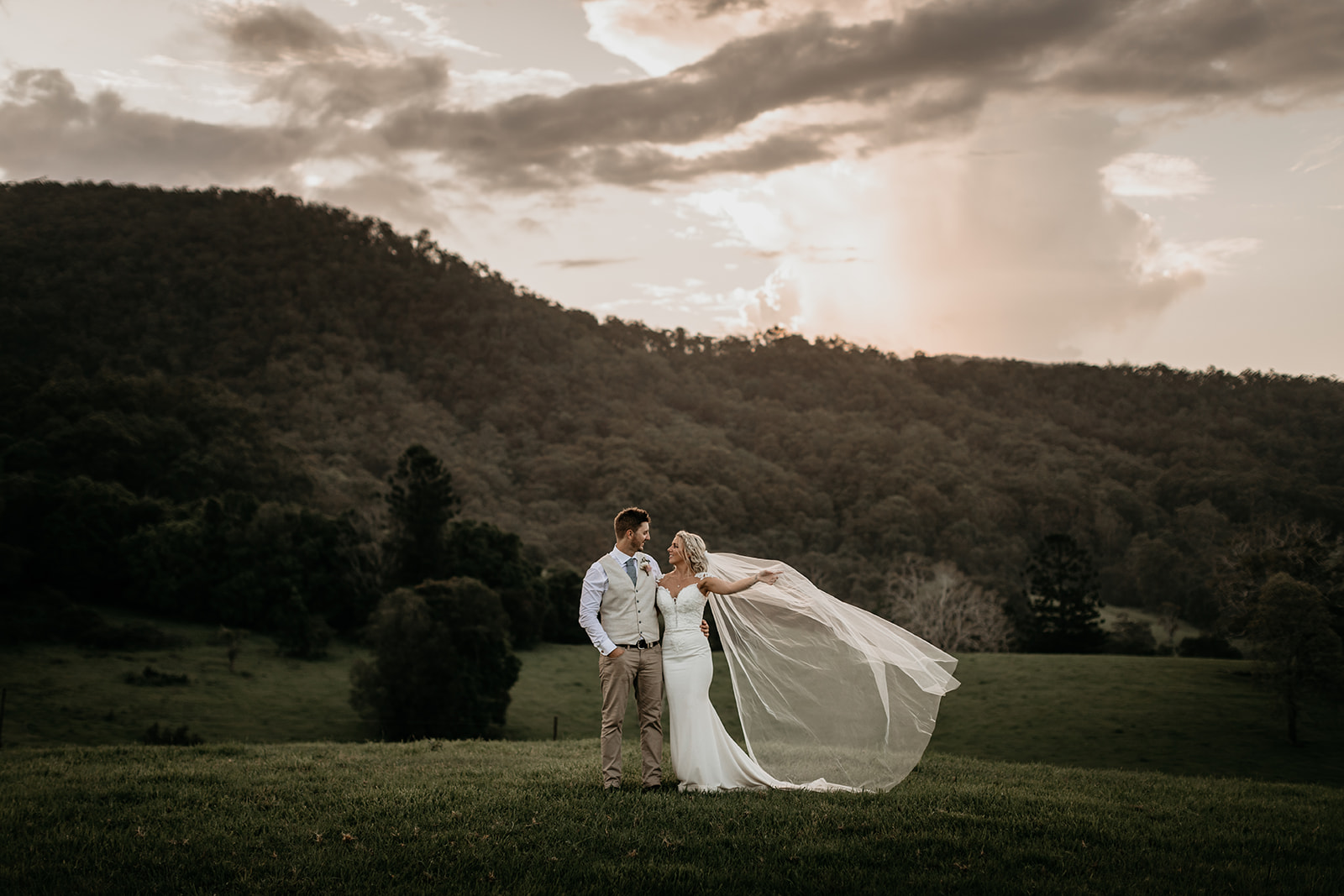 bride and groom in front of beautiful mountainscape