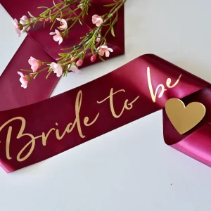 Burgandy sash with gold lettering