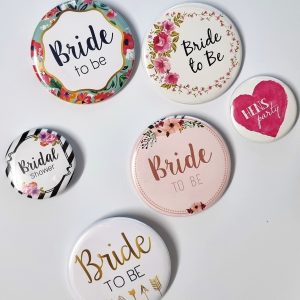 assorted colourful hens party badges