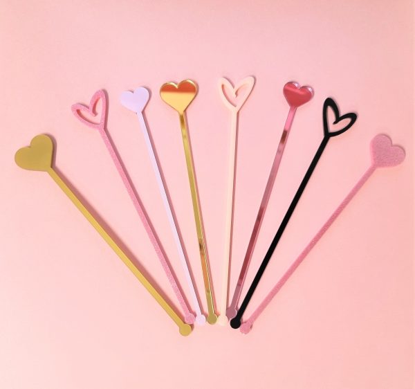 a range of cocktail stirrers in various heart designs