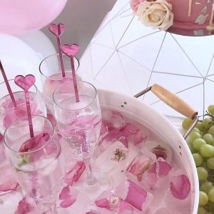 pink heart cocktail stirrers in cocktails