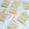 stack of bride tribe gold foil temporary tattoos