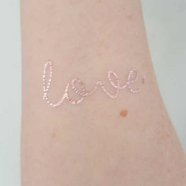 rose gold foil love temporary tattoo on wrist