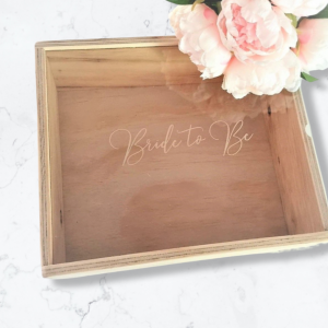 custom engraved acrylic lidded wooden box reading 'Bride to Be' on a marble floor