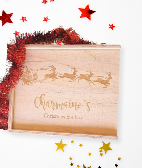 custom engraved personalised christmas eve box with santa sleigh design reading "charmaines christmas eve box"