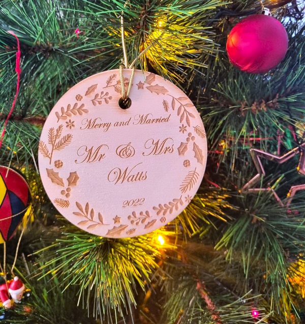custom personalised wooden christmas ornament celebrating a couple's first christmas married